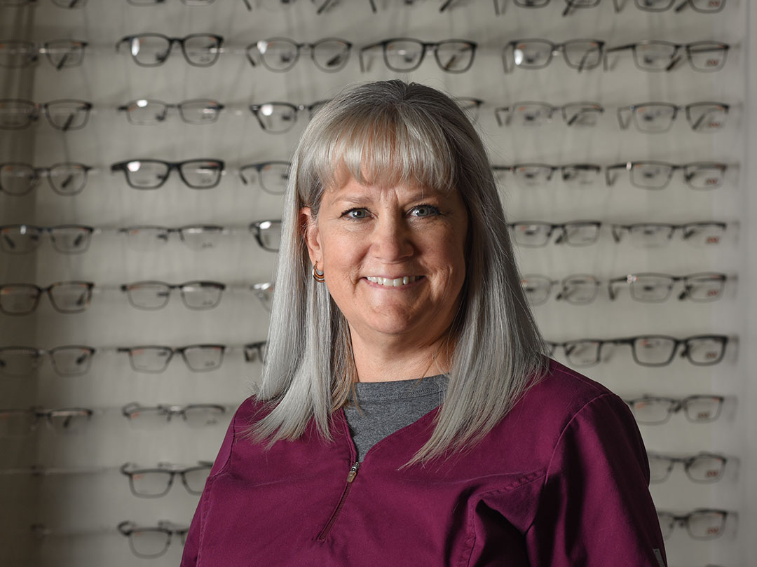 Longmont Optical Center Staff In Front of EyeGlasses Shelf Photo